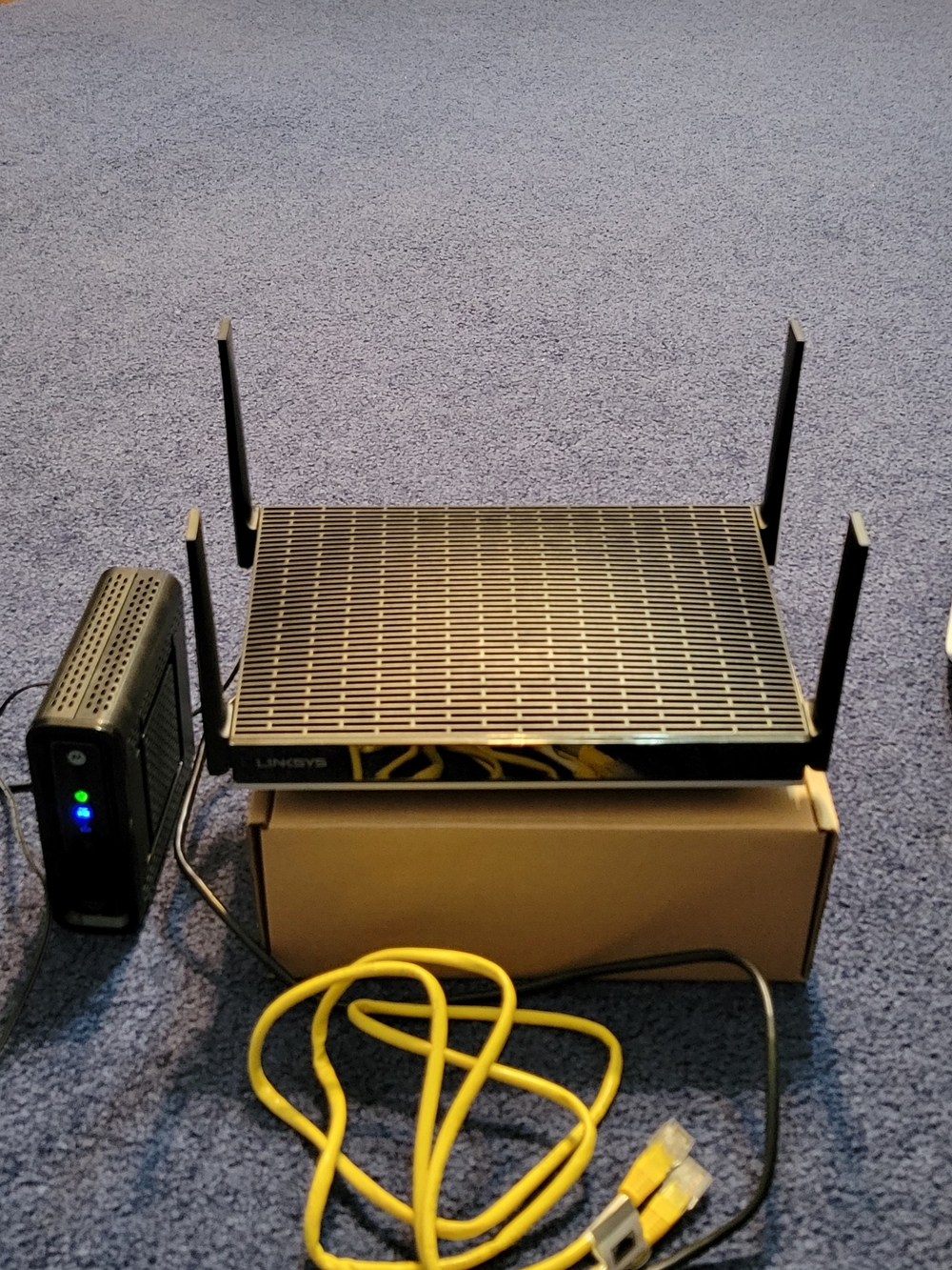 Linksys Black Wireless Router with Yellow Ethernet Cable